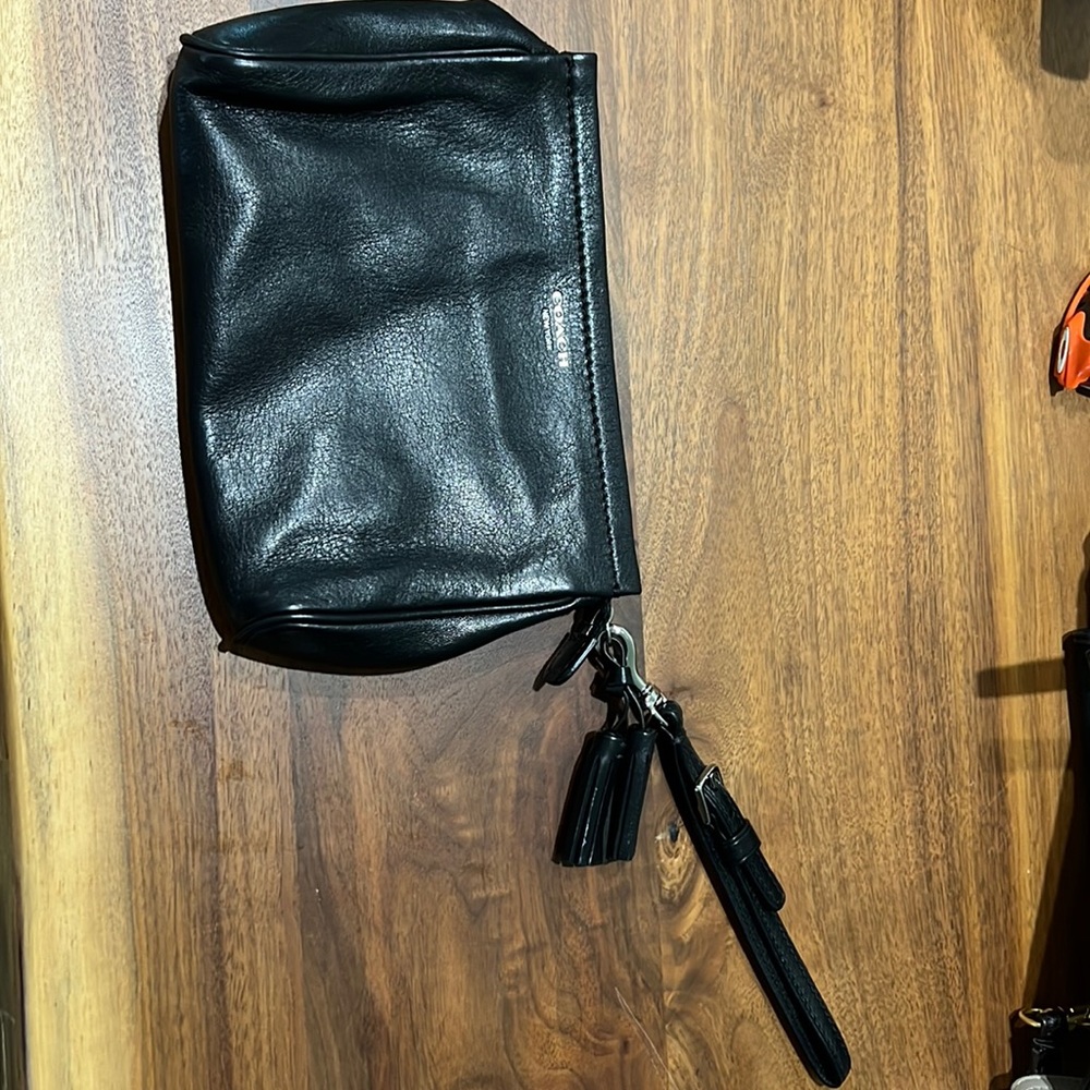 Black Coach wristlet with spot for credit cards